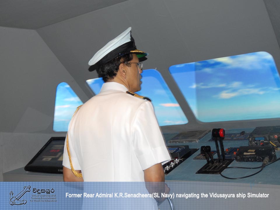 Rear Admiral K.R.Senadheera (SL Navy) navigating the Vidusayura ship simulator.